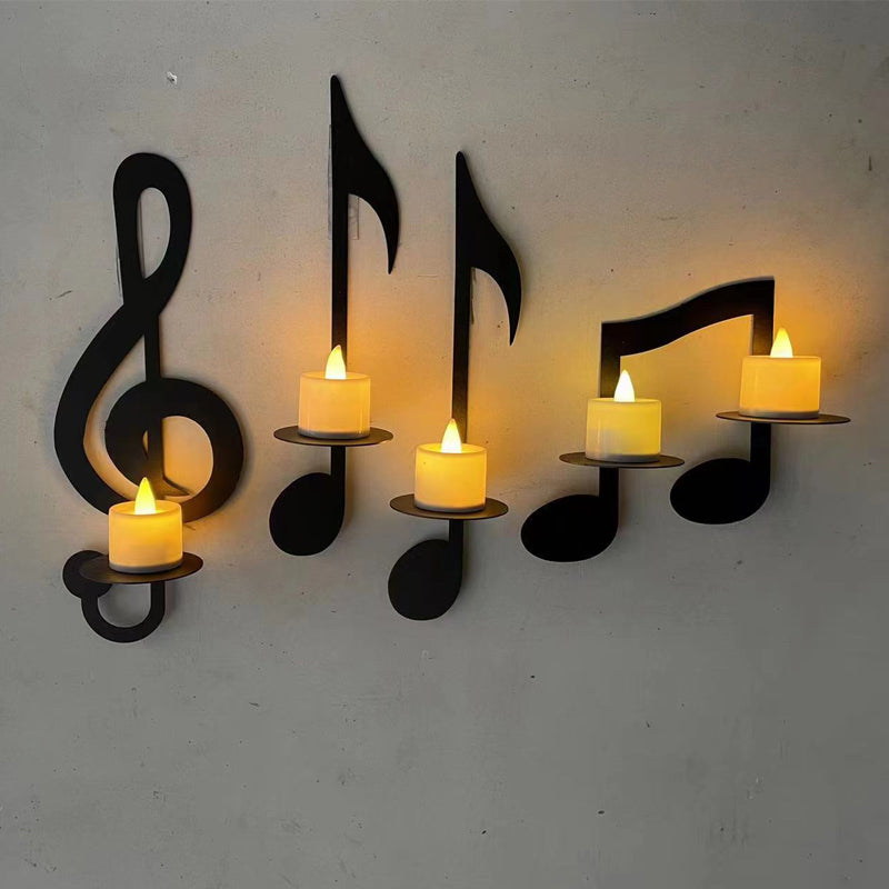 Sorte vægmonterede musiknode-lysestager