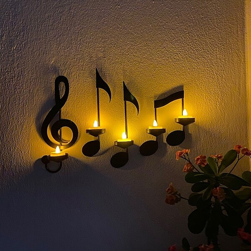 Sorte vægmonterede musiknode-lysestager